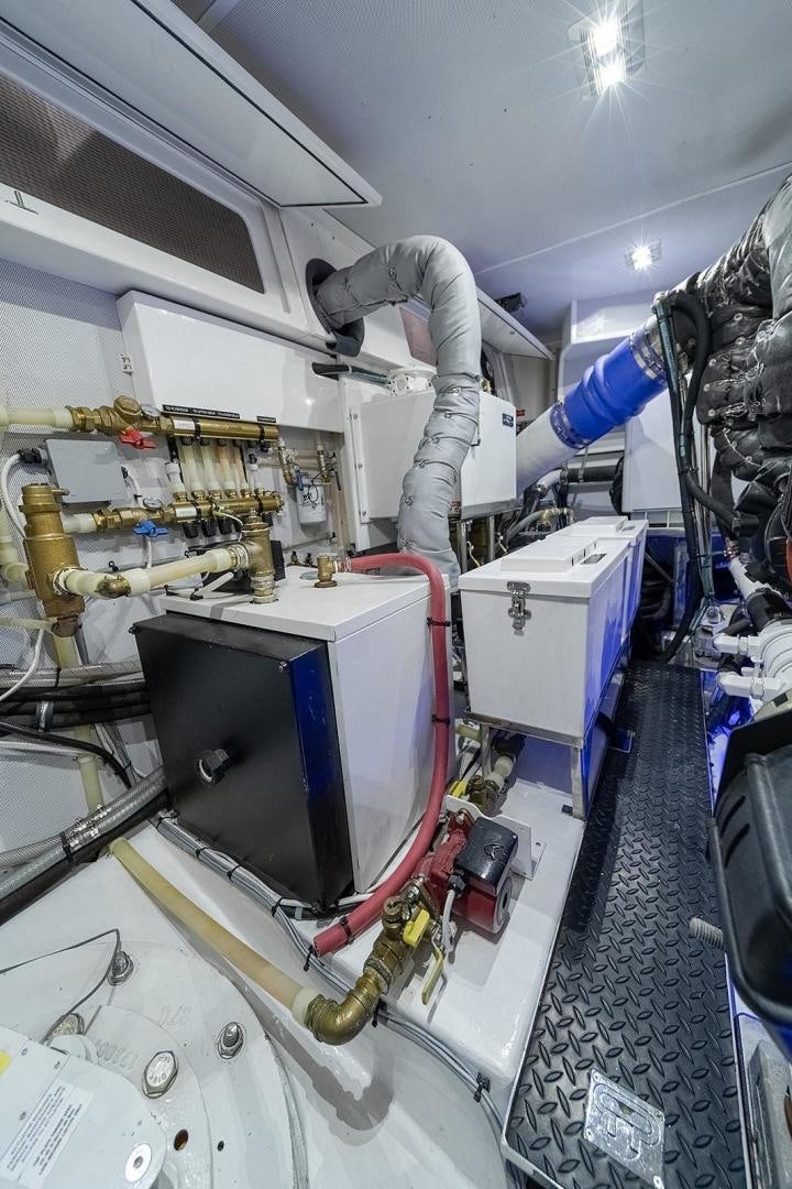 a person working on a machine aboard PARADISE Yacht for Sale