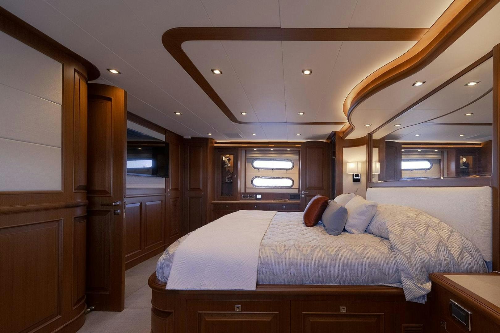 a bedroom with a bed aboard PARADISE Yacht for Sale
