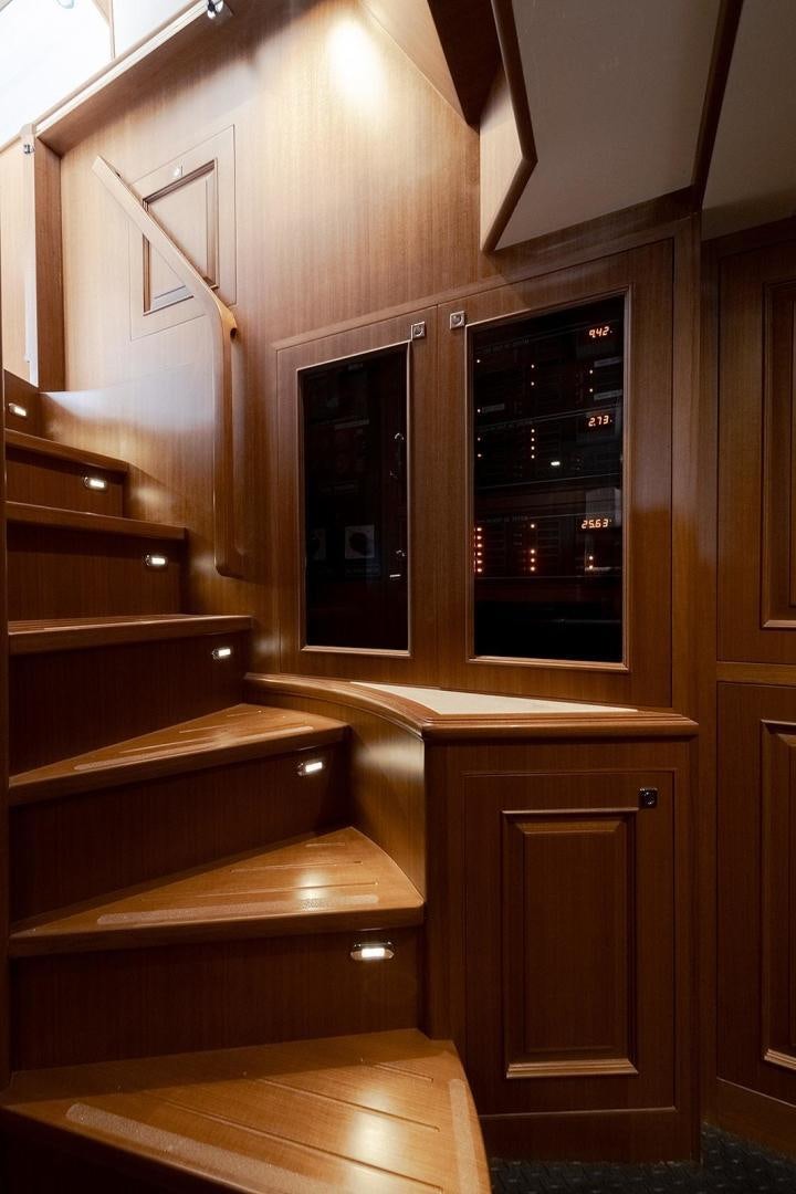 a wooden cabinet with drawers aboard PARADISE Yacht for Sale