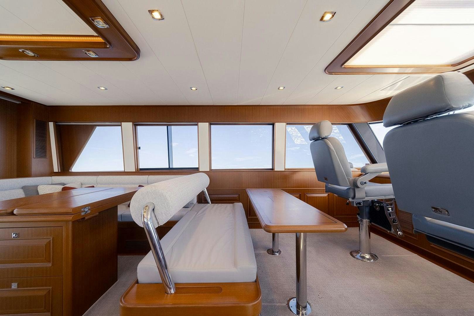 a room with a bed and a desk aboard PARADISE Yacht for Sale
