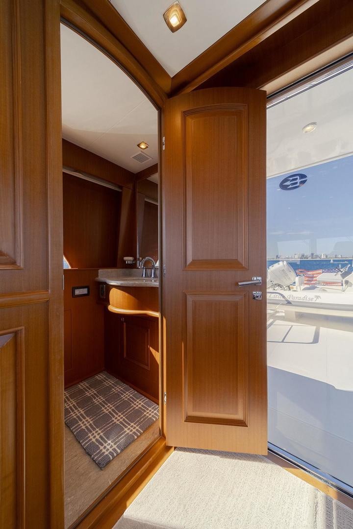 a bathroom with a glass door aboard PARADISE Yacht for Sale