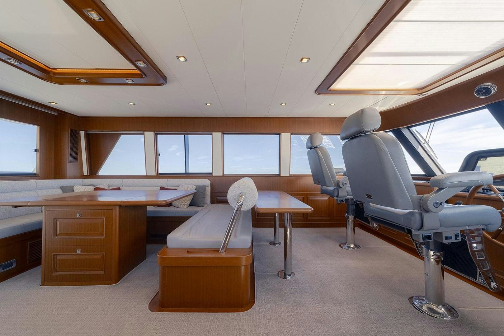 a room with a desk and chairs aboard PARADISE Yacht for Sale
