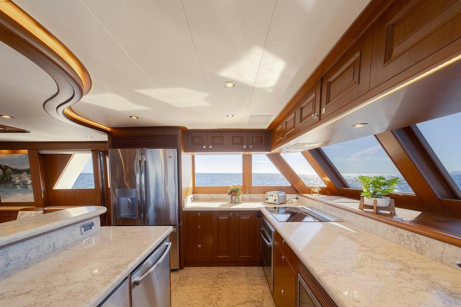 a kitchen with a large island aboard PARADISE Yacht for Sale