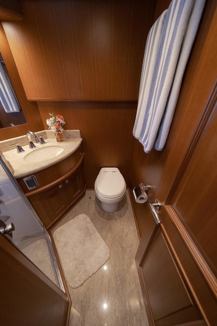 a bathroom with a toilet and sink aboard PARADISE Yacht for Sale