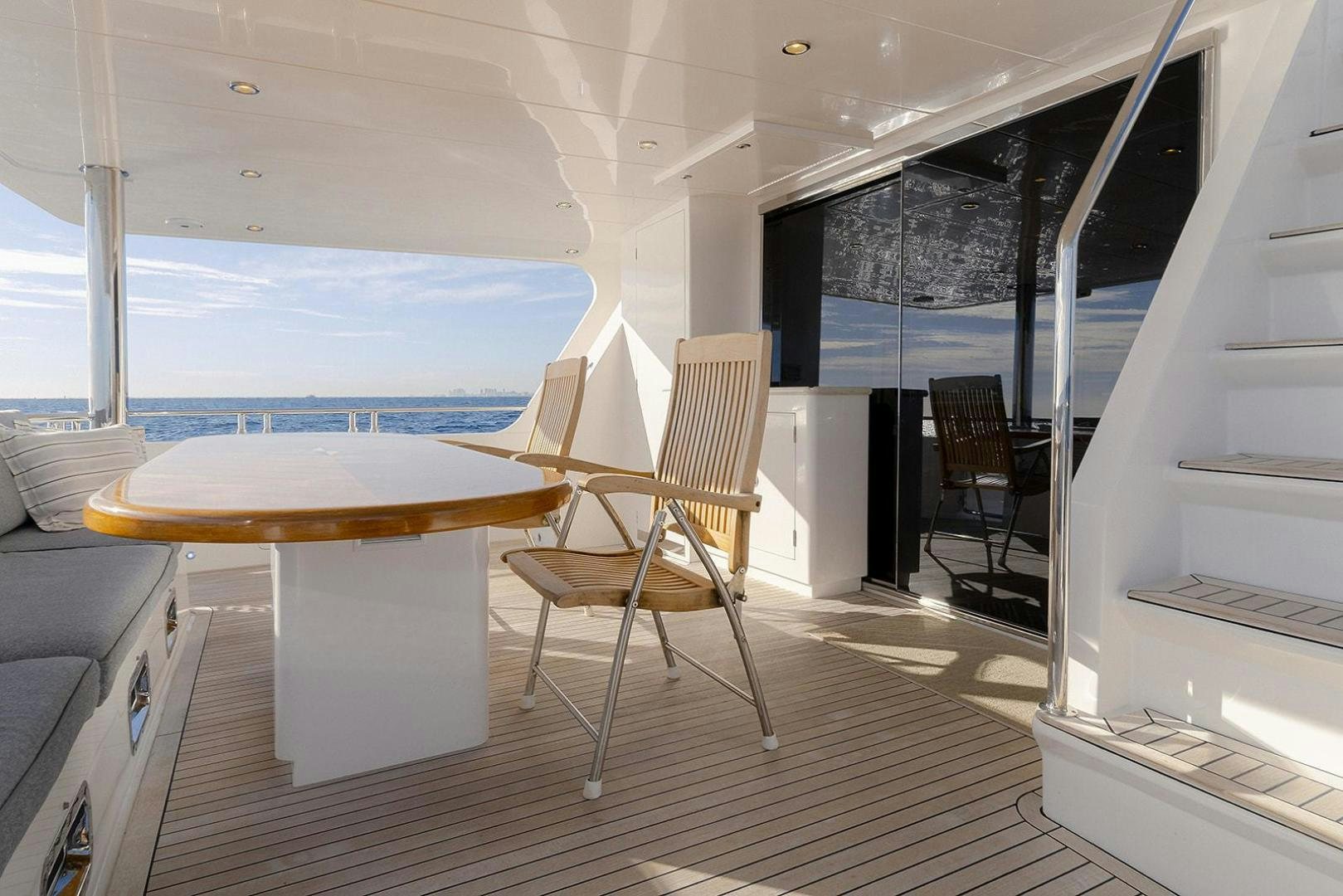 a room with a table and chairs aboard PARADISE Yacht for Sale