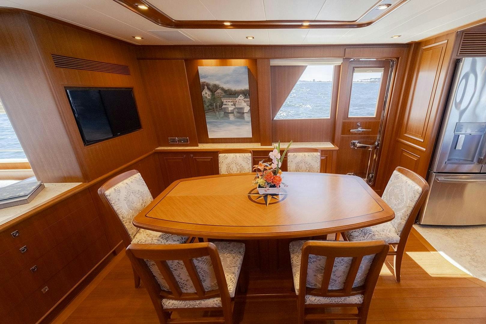 a dining table in a room aboard PARADISE Yacht for Sale