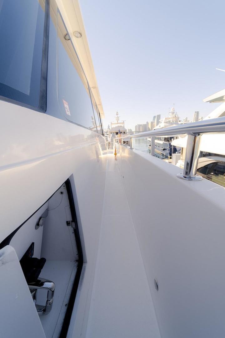 a white boat on a body of water aboard PARADISE Yacht for Sale