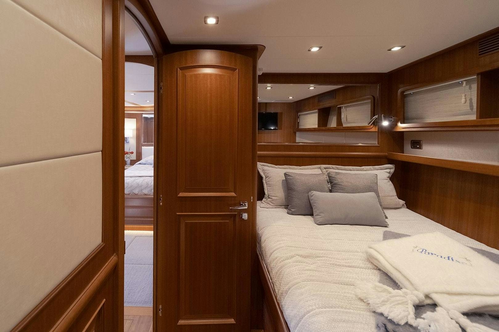 a hotel room with a bed aboard PARADISE Yacht for Sale