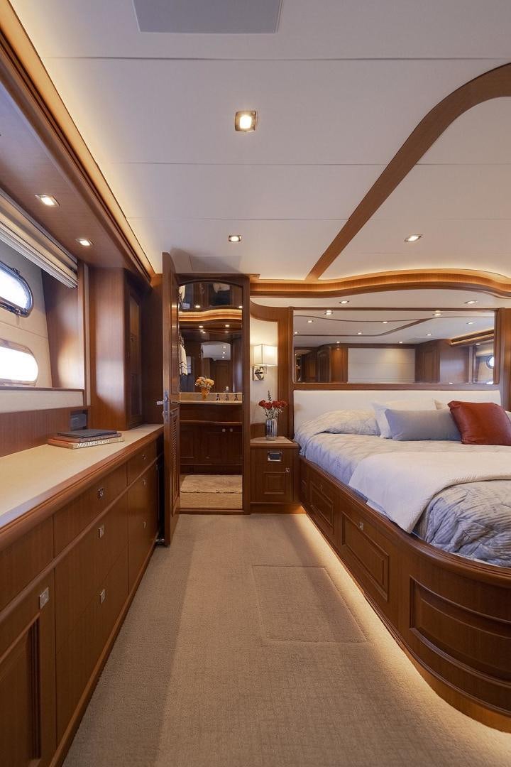 a bedroom with two beds aboard PARADISE Yacht for Sale