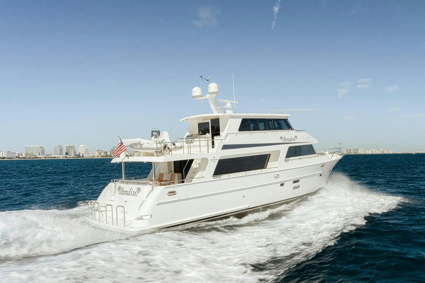 a large white boat on the water aboard PARADISE Yacht for Sale