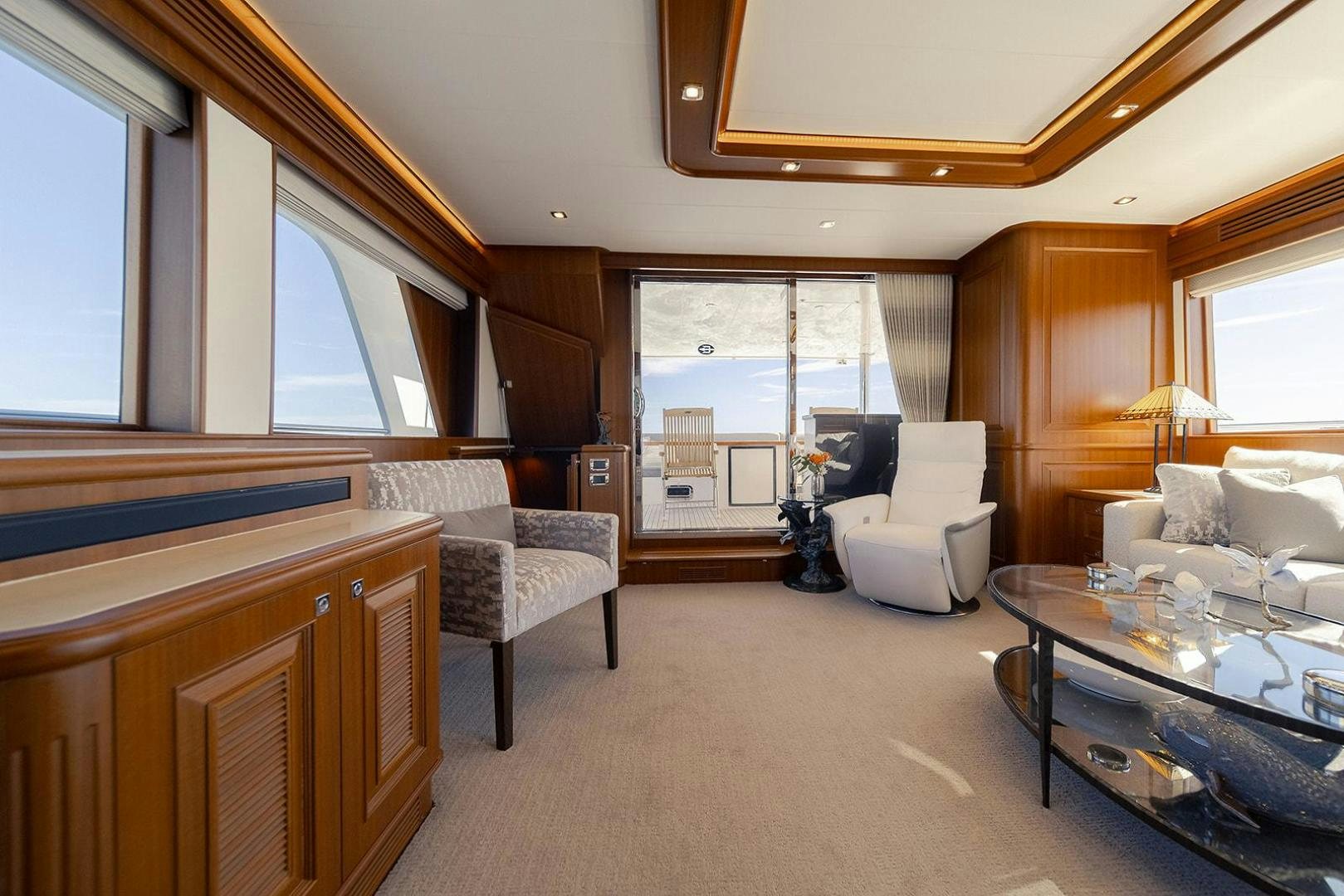 a living room with a large window aboard PARADISE Yacht for Sale