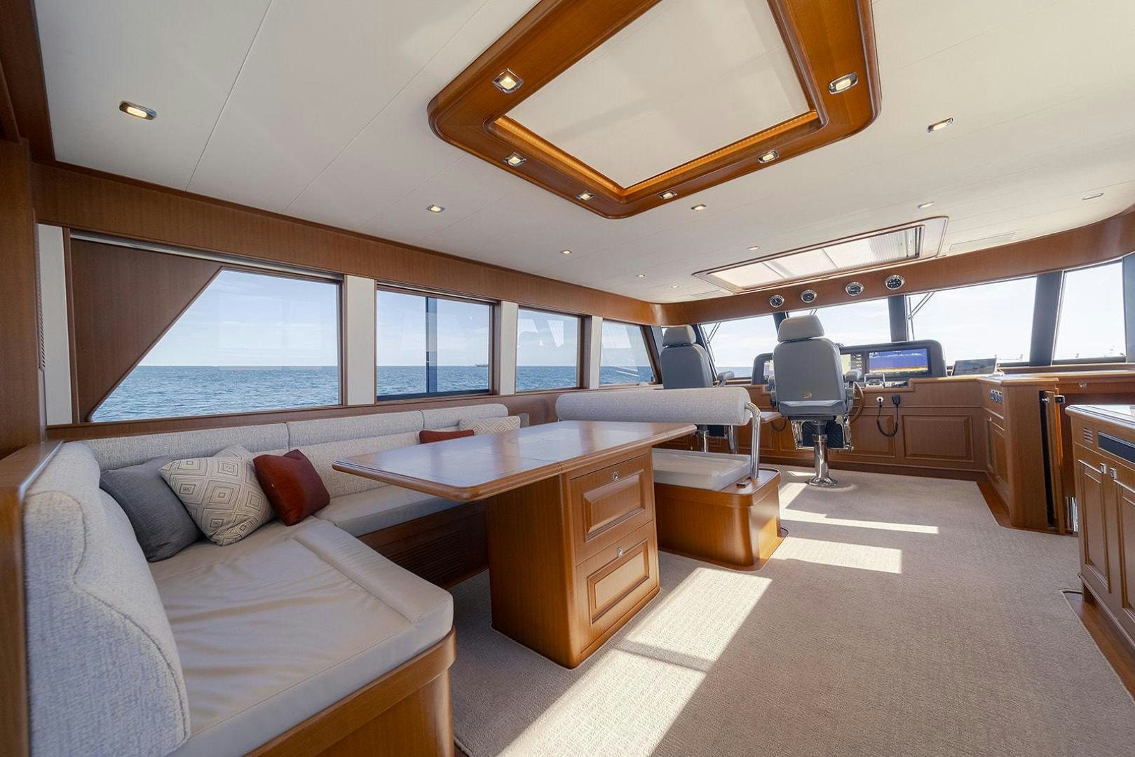 a room with a couch and a desk aboard PARADISE Yacht for Sale