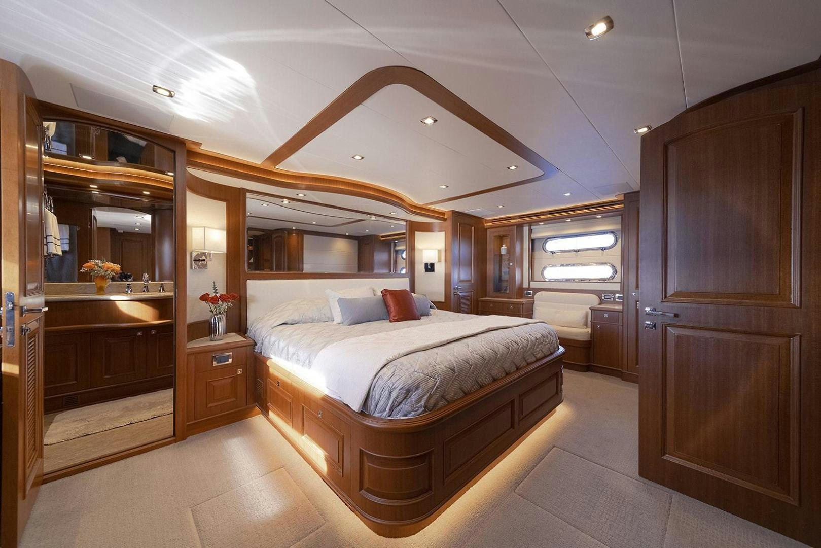 a bedroom with a bed and a closet aboard PARADISE Yacht for Sale