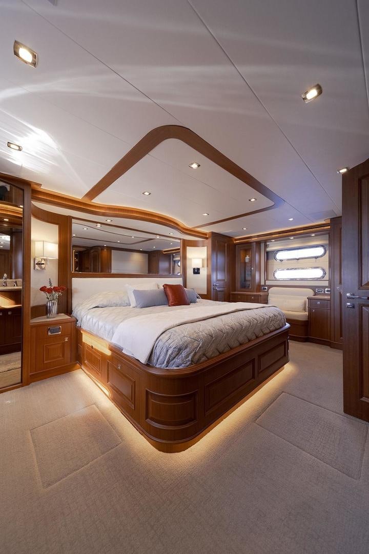 a bedroom with a bed aboard PARADISE Yacht for Sale