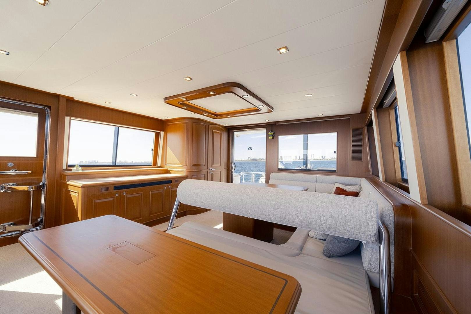 a room with a table and chairs aboard PARADISE Yacht for Sale