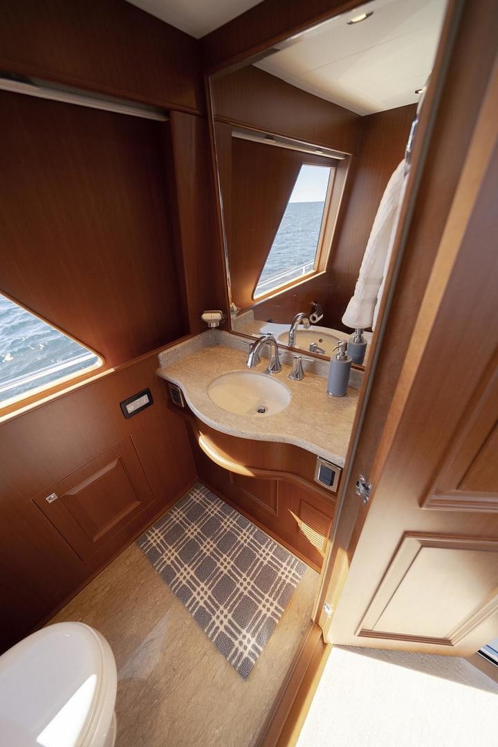 a bathroom with a sink and a mirror aboard PARADISE Yacht for Sale