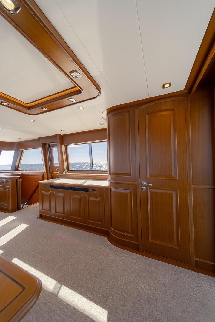 a room with wooden cabinets aboard PARADISE Yacht for Sale