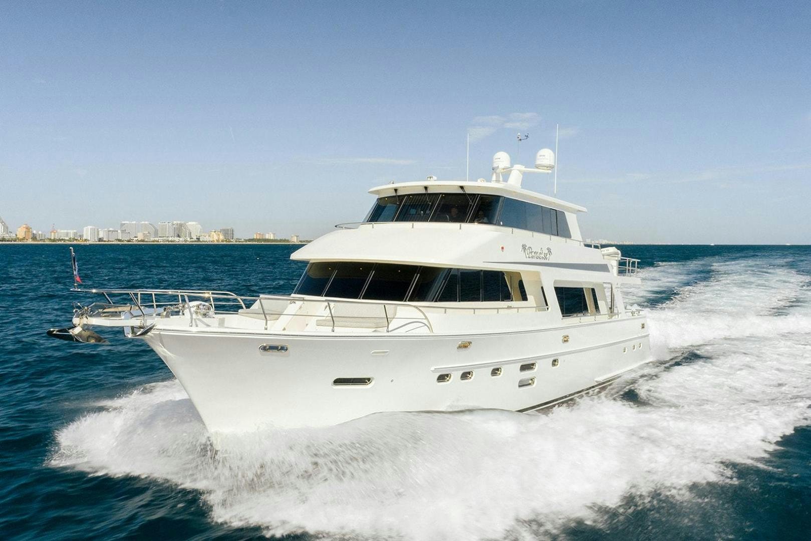 a white boat on the water aboard PARADISE Yacht for Sale