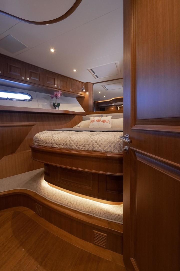 a room with wooden cabinets aboard PARADISE Yacht for Sale