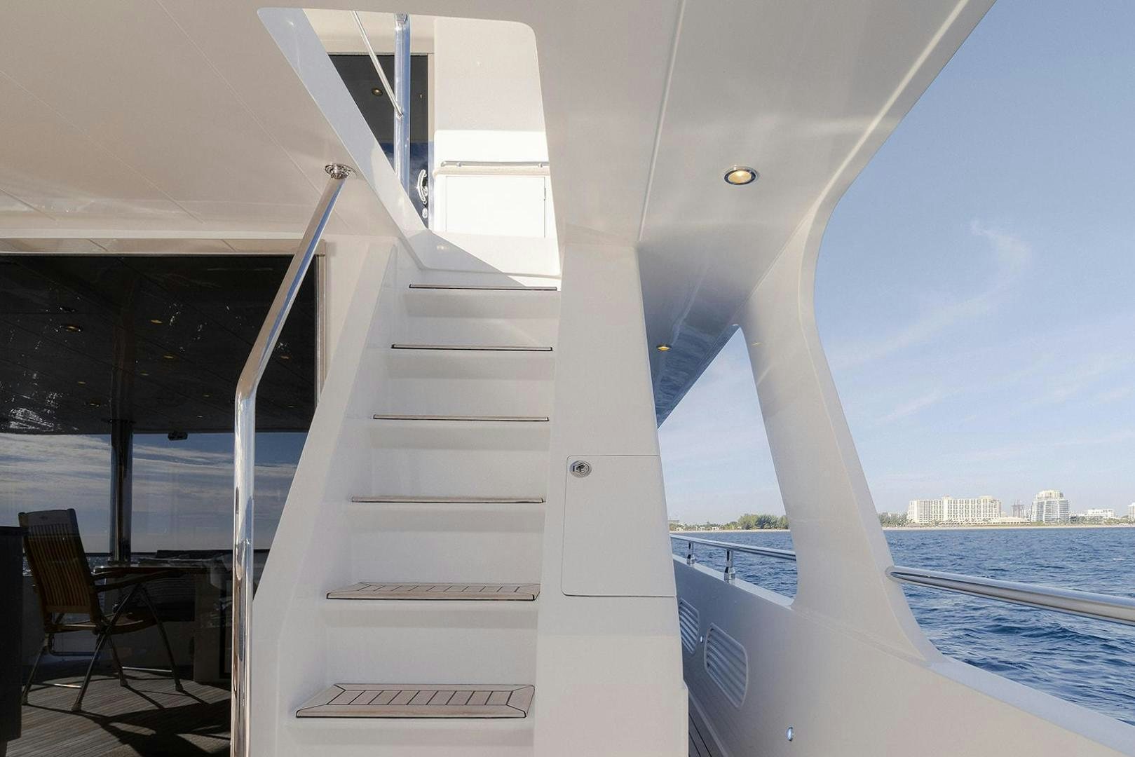 a white staircase leading to a balcony aboard PARADISE Yacht for Sale