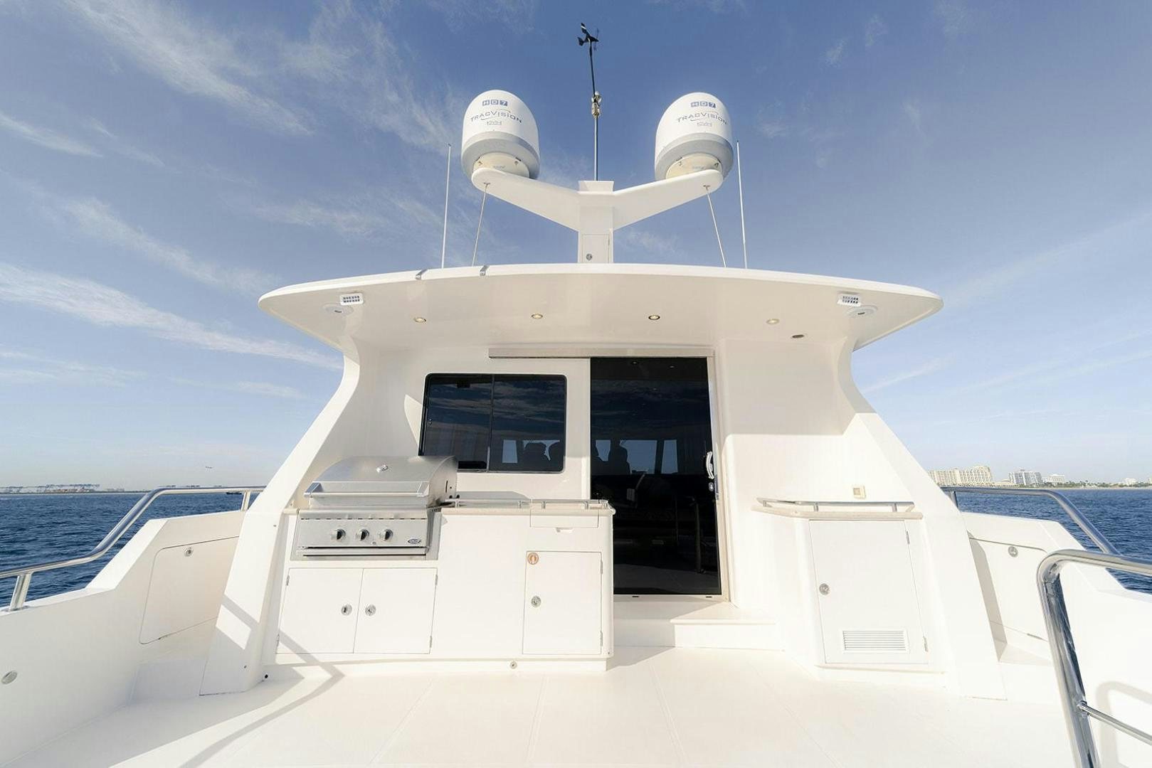 a white boat on a body of water aboard PARADISE Yacht for Sale