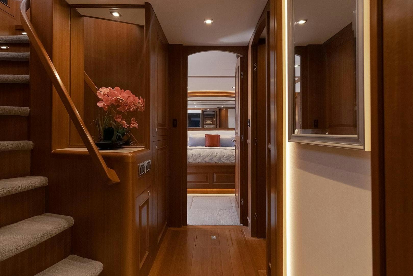 a room with a bed and a mirror aboard PARADISE Yacht for Sale