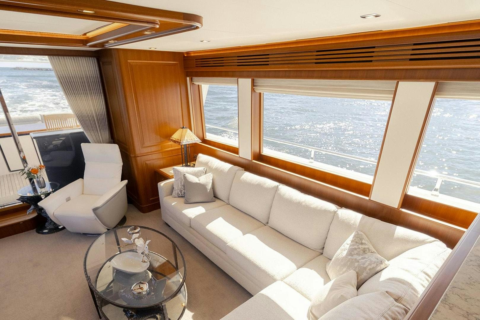 a living room with a large window aboard PARADISE Yacht for Sale