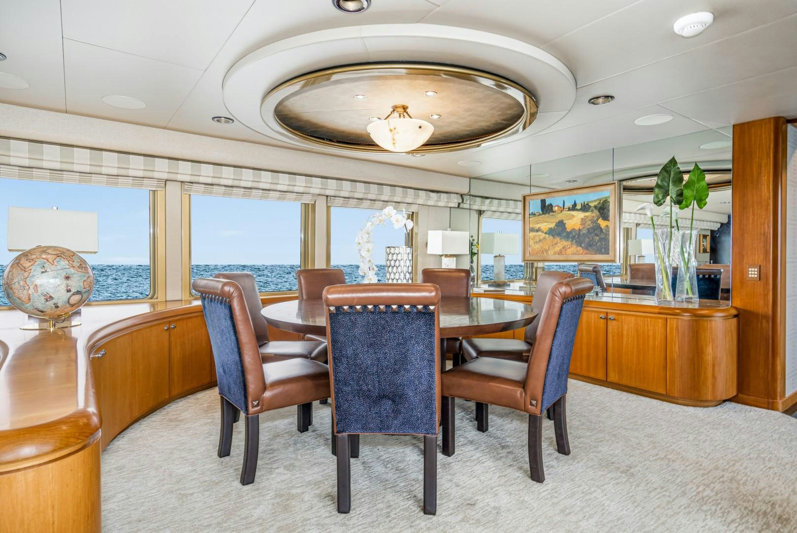 a room with a table and chairs aboard AFTERGLOW Yacht for Sale