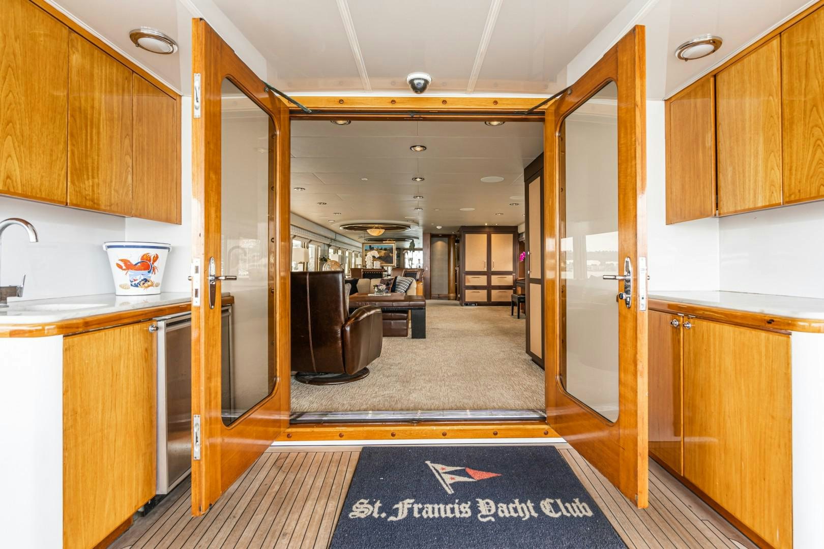 a kitchen with wooden cabinets aboard AFTERGLOW Yacht for Sale