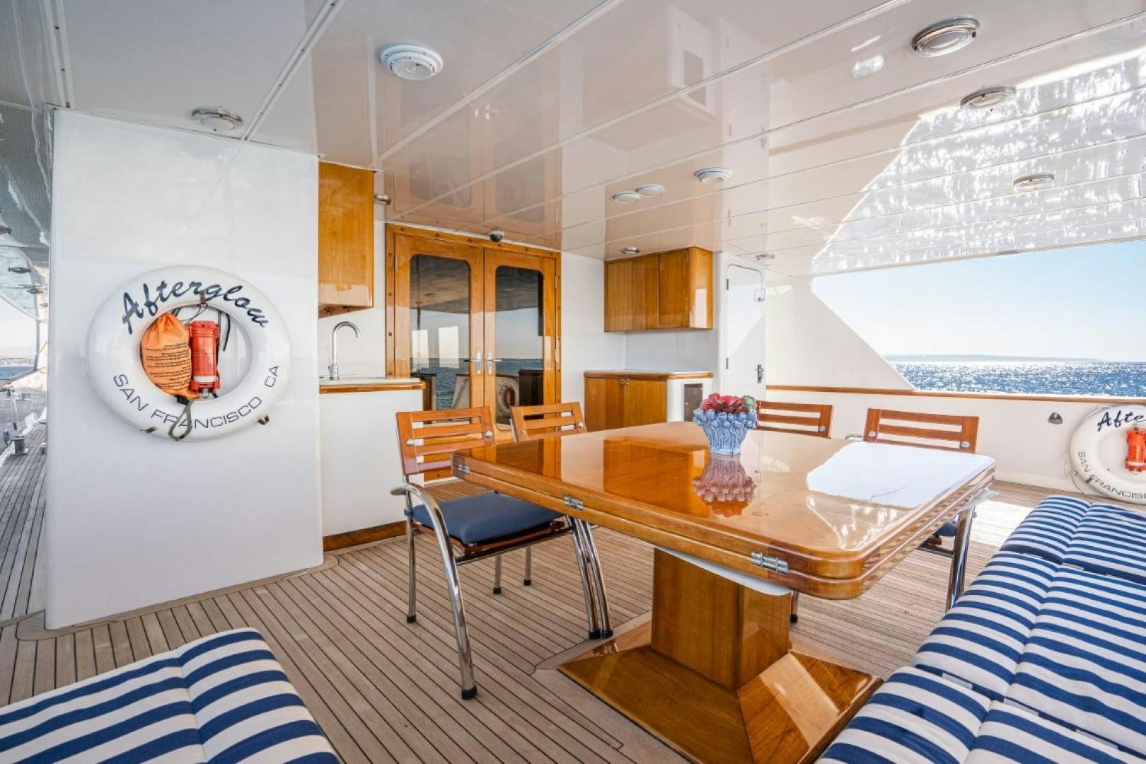 a room with a table and chairs aboard AFTERGLOW Yacht for Sale