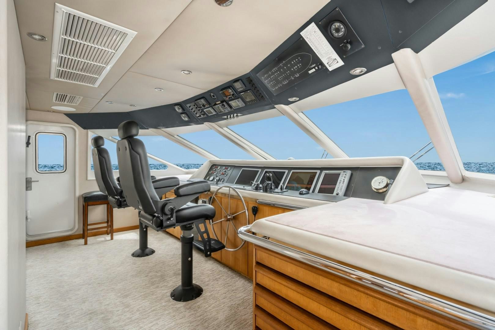 a room with a piano and a chair aboard AFTERGLOW Yacht for Sale