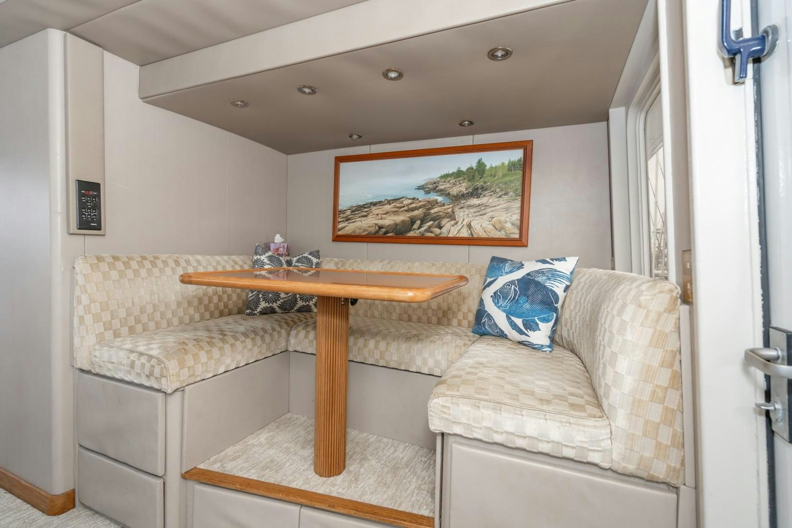 a living room with a couch and a table aboard AFTERGLOW Yacht for Sale