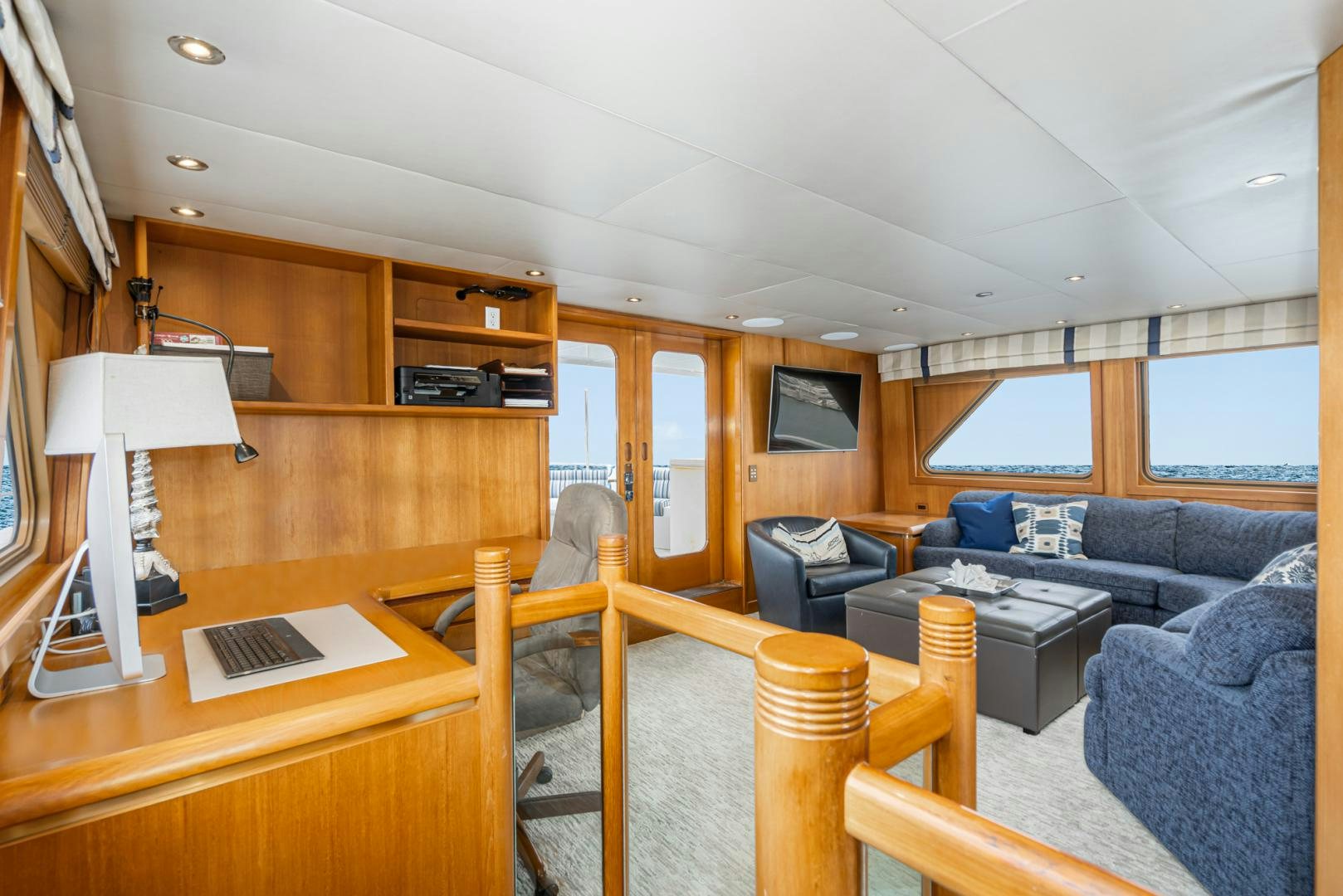 a living room with a couch and a desk aboard AFTERGLOW Yacht for Sale