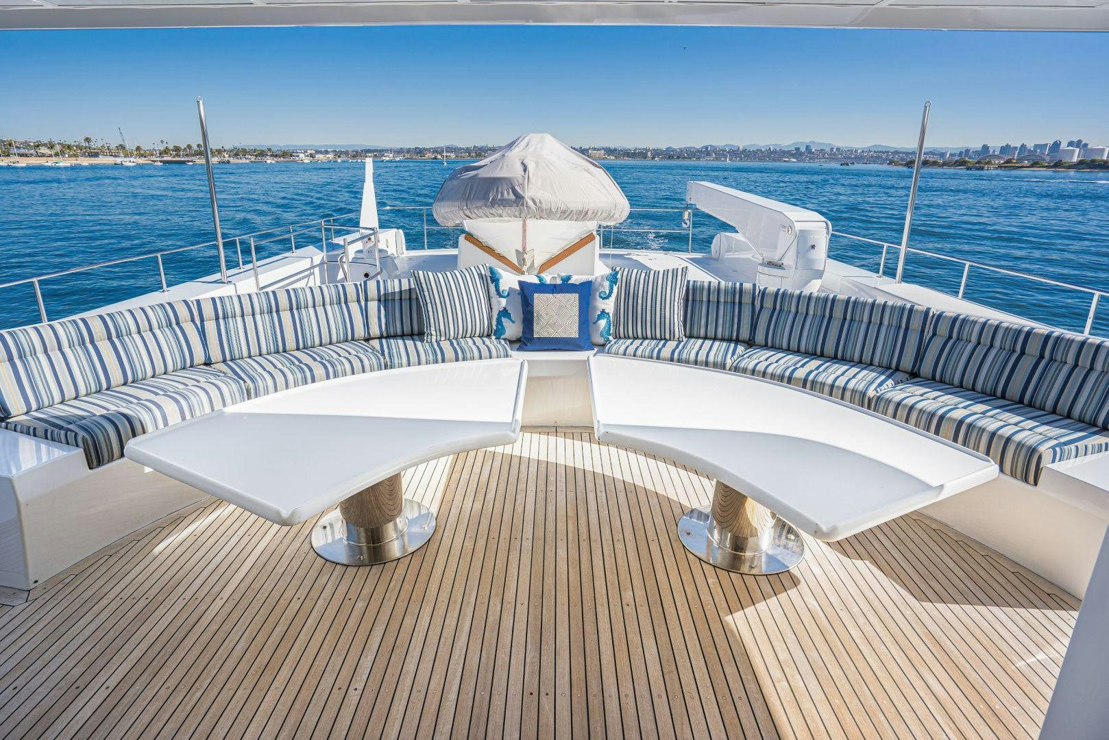 a deck with lounge chairs and umbrellas on it aboard AFTERGLOW Yacht for Sale