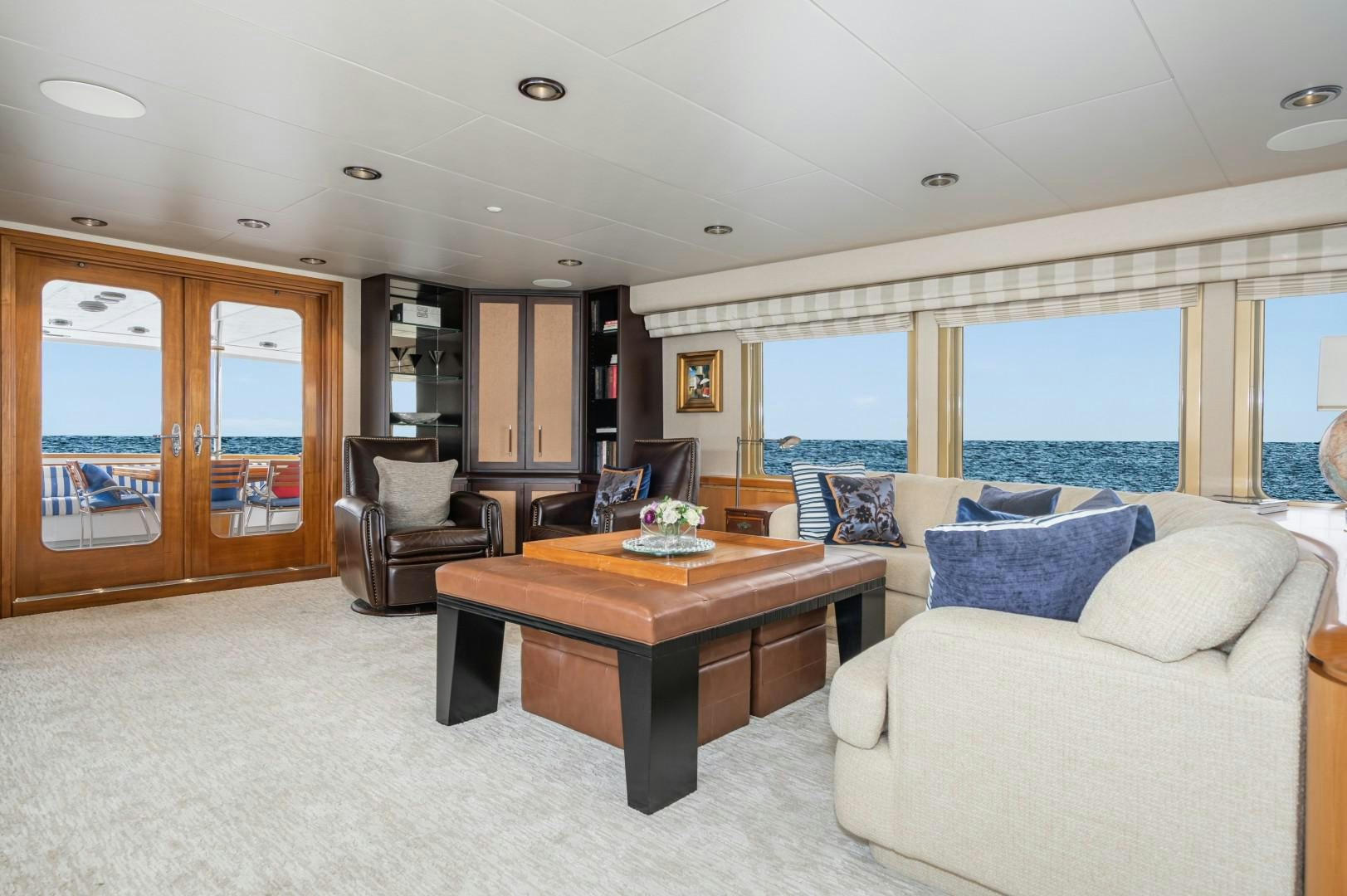 a living room with a large window aboard AFTERGLOW Yacht for Sale