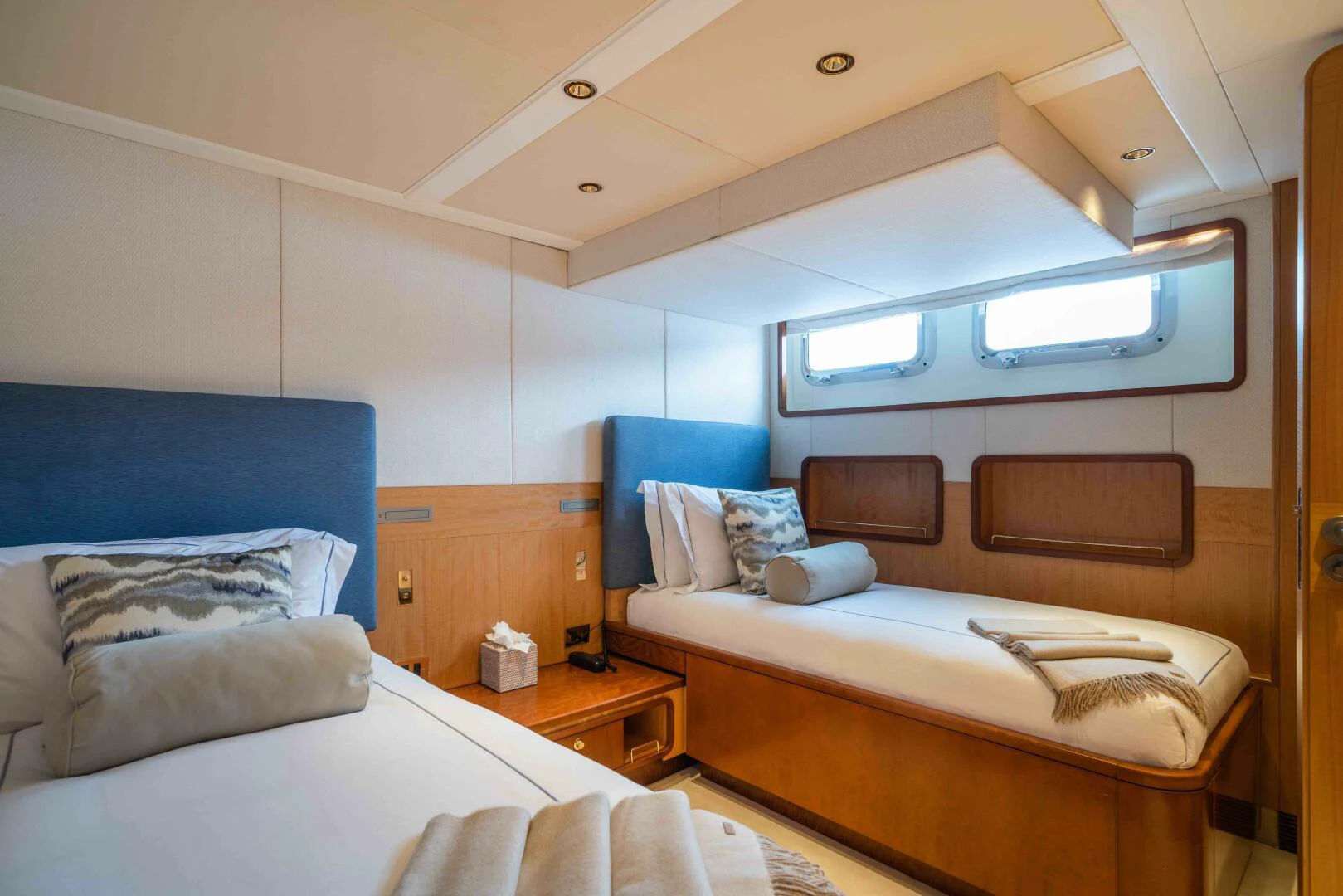 a room with two beds aboard SYNTHESIS 66 Yacht for Sale