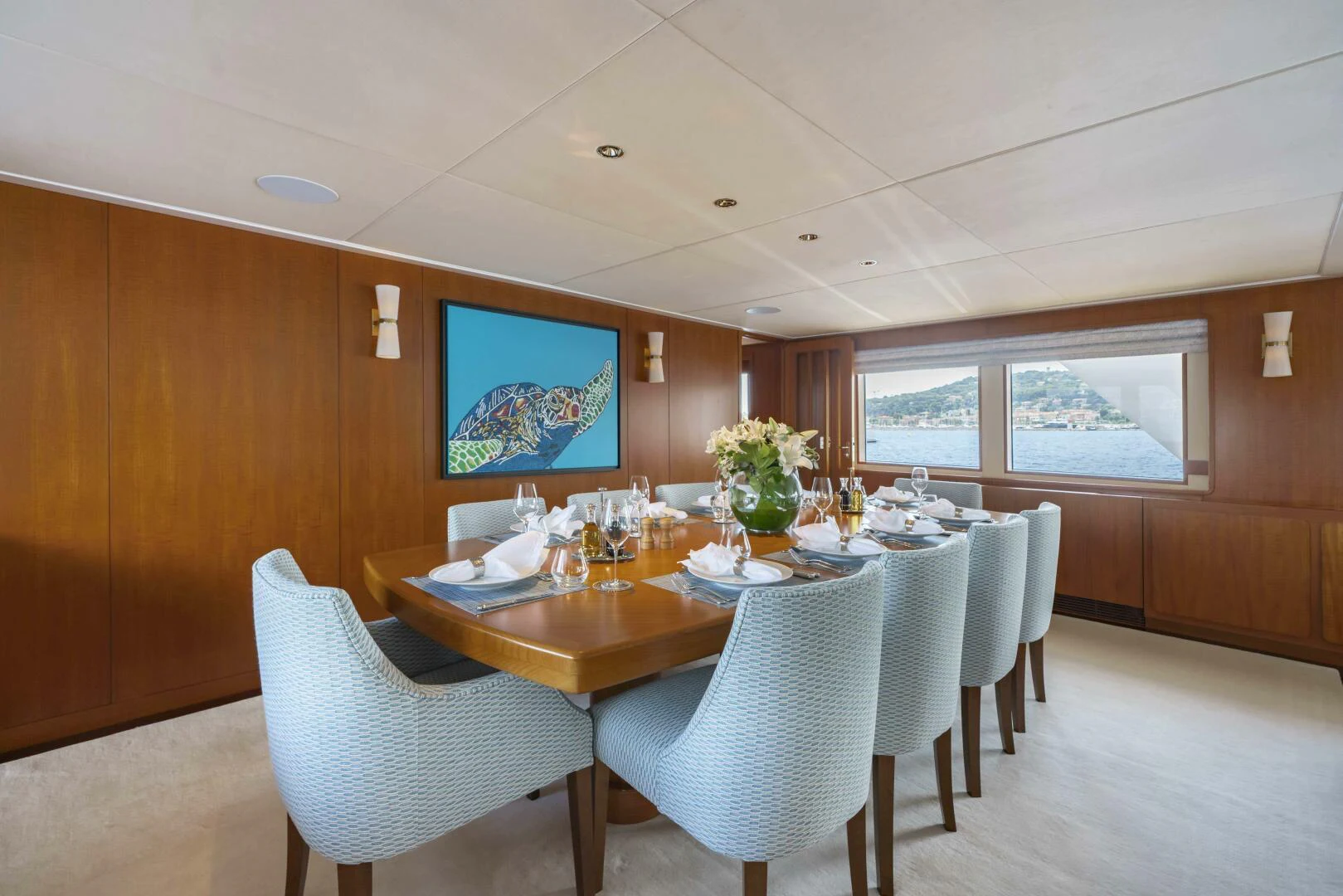 a dining room with a table and chairs aboard SYNTHESIS 66 Yacht for Sale