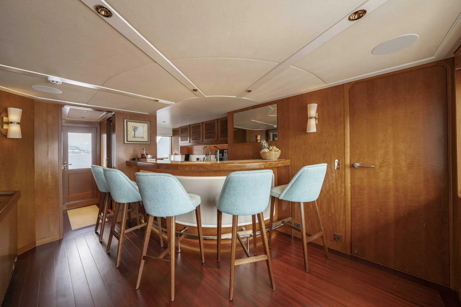a kitchen with a table and chairs aboard SYNTHESIS 66 Yacht for Sale
