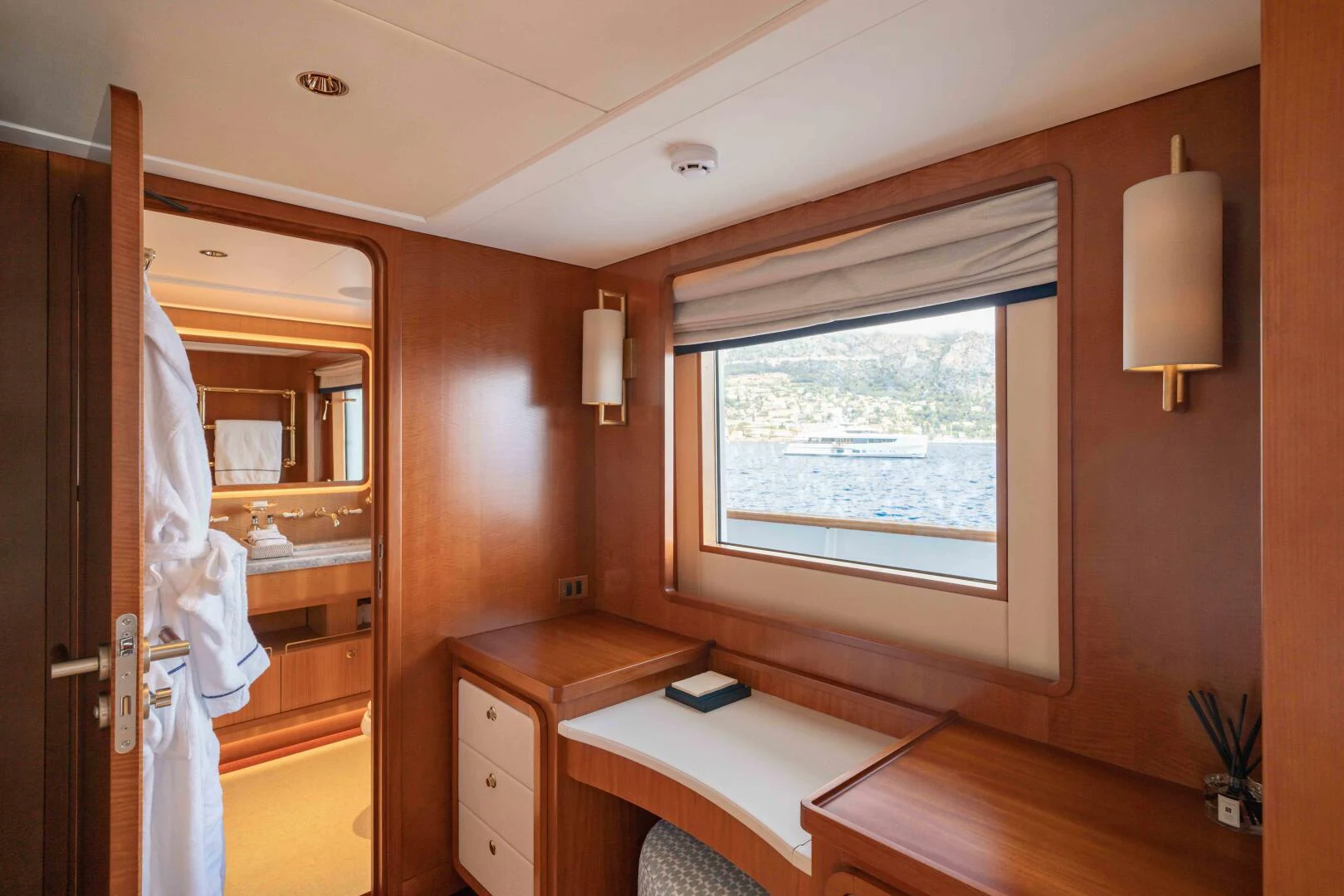 a room with a bed and a window aboard SYNTHESIS 66 Yacht for Sale