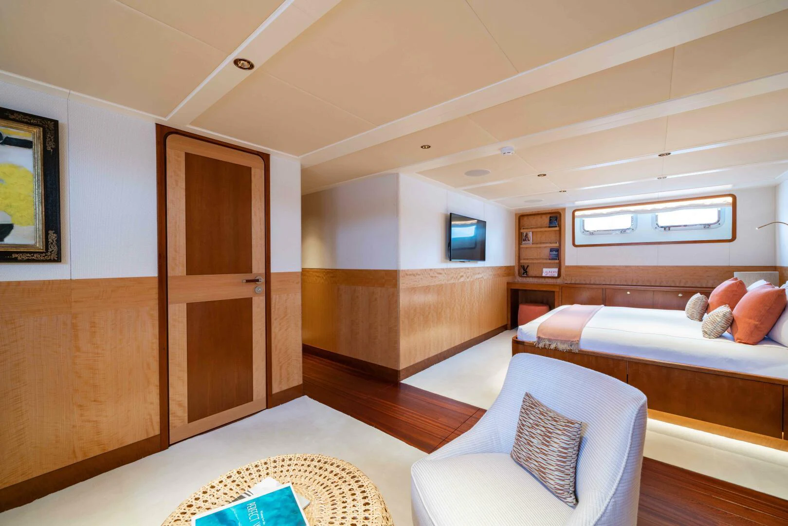 a room with a bed and a couch aboard SYNTHESIS 66 Yacht for Sale