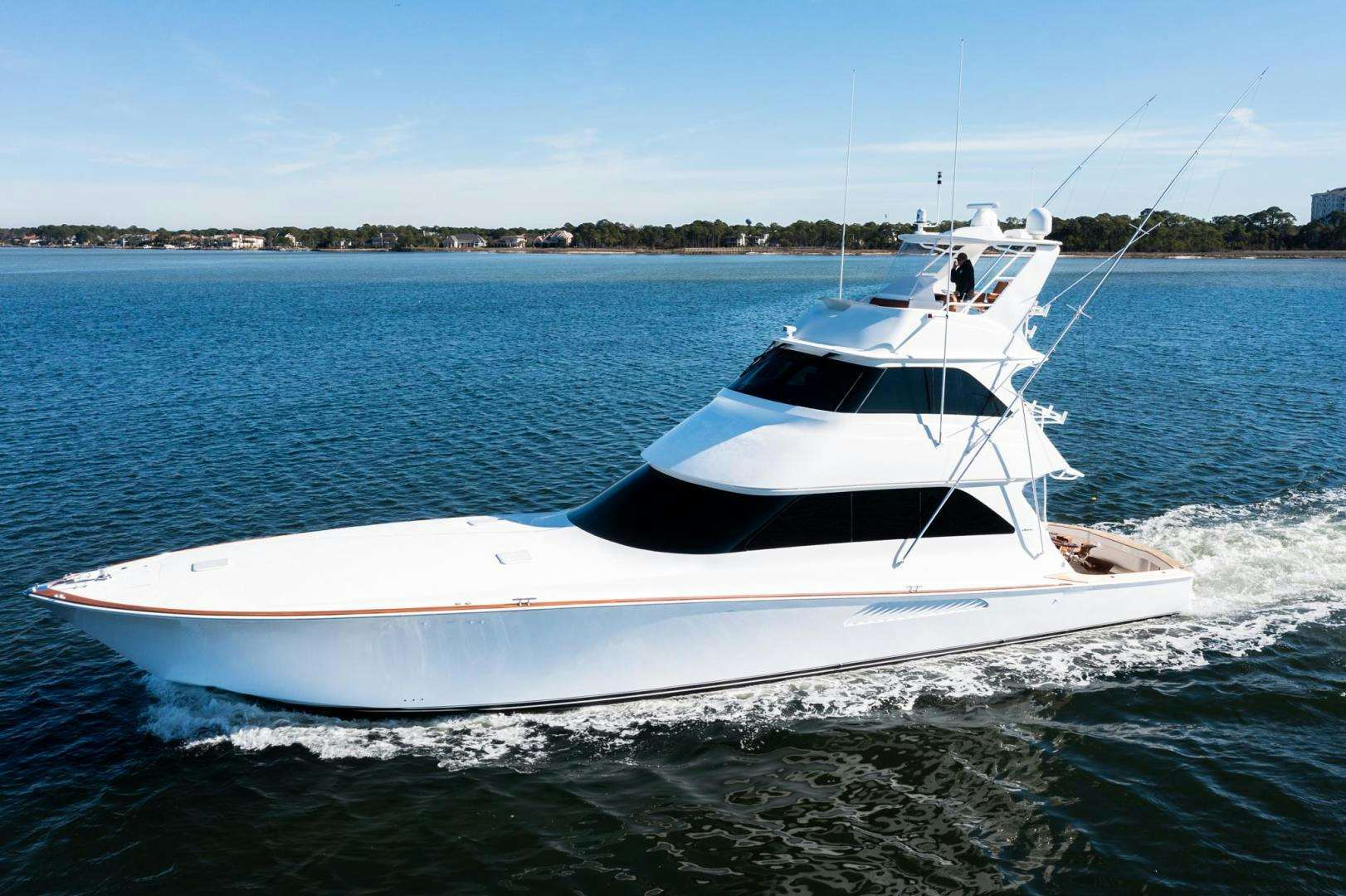 a white boat on the water aboard LIQUID APPLE Yacht for Sale