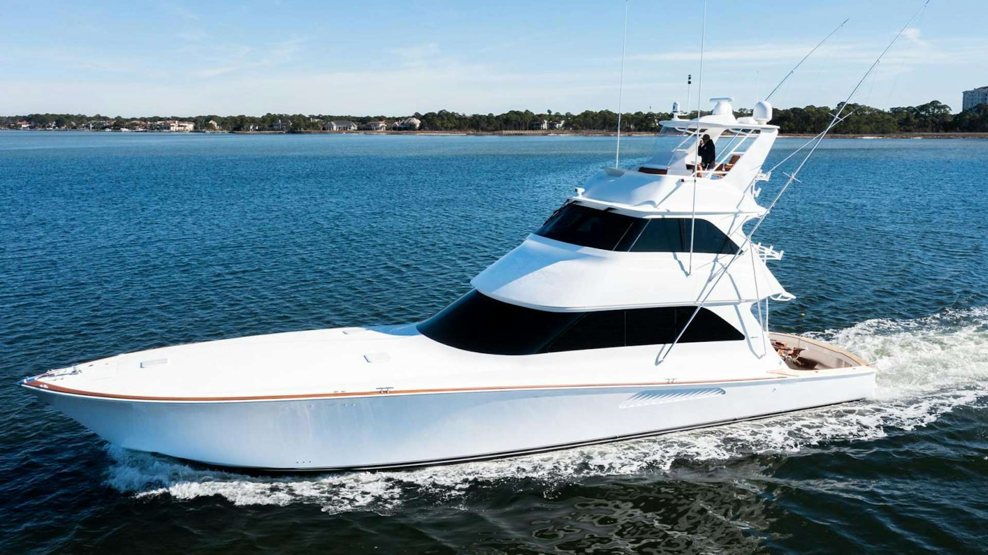 a white boat on the water aboard LIQUID APPLE Yacht for Sale