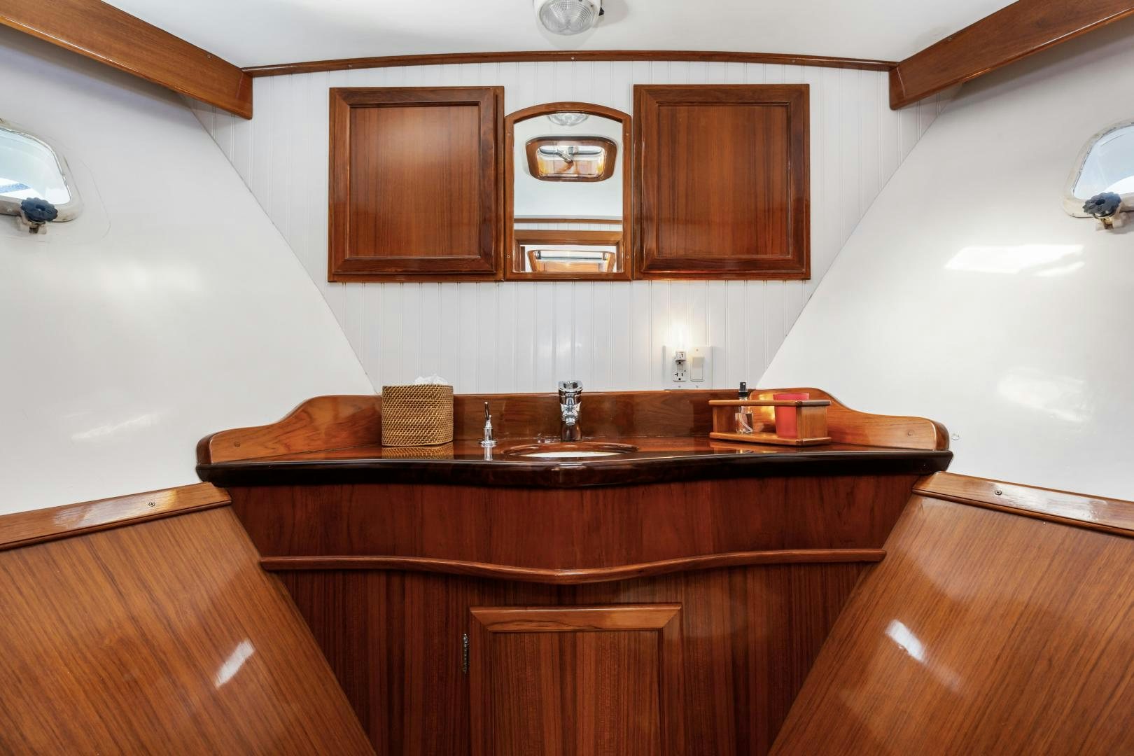 a kitchen with wooden cabinets aboard SILVER OAK Yacht for Sale