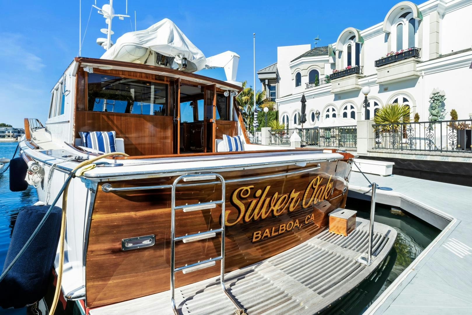 a boat with a sign on the front aboard SILVER OAK Yacht for Sale