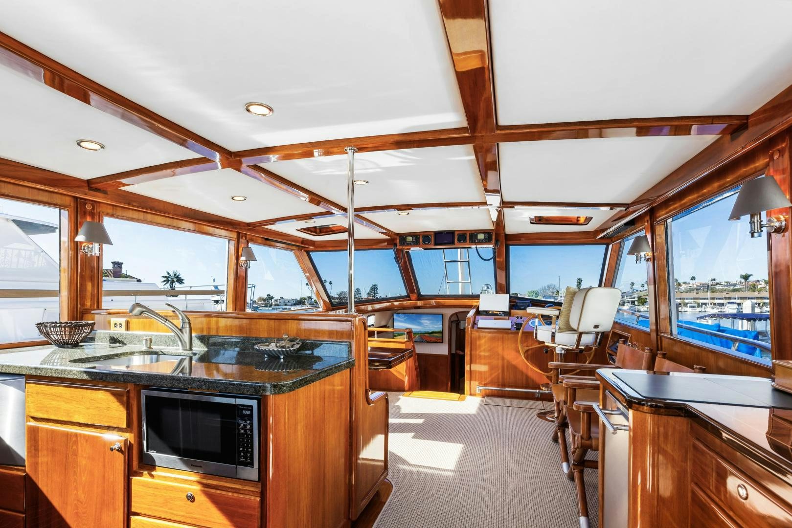 a kitchen with a large window aboard SILVER OAK Yacht for Sale