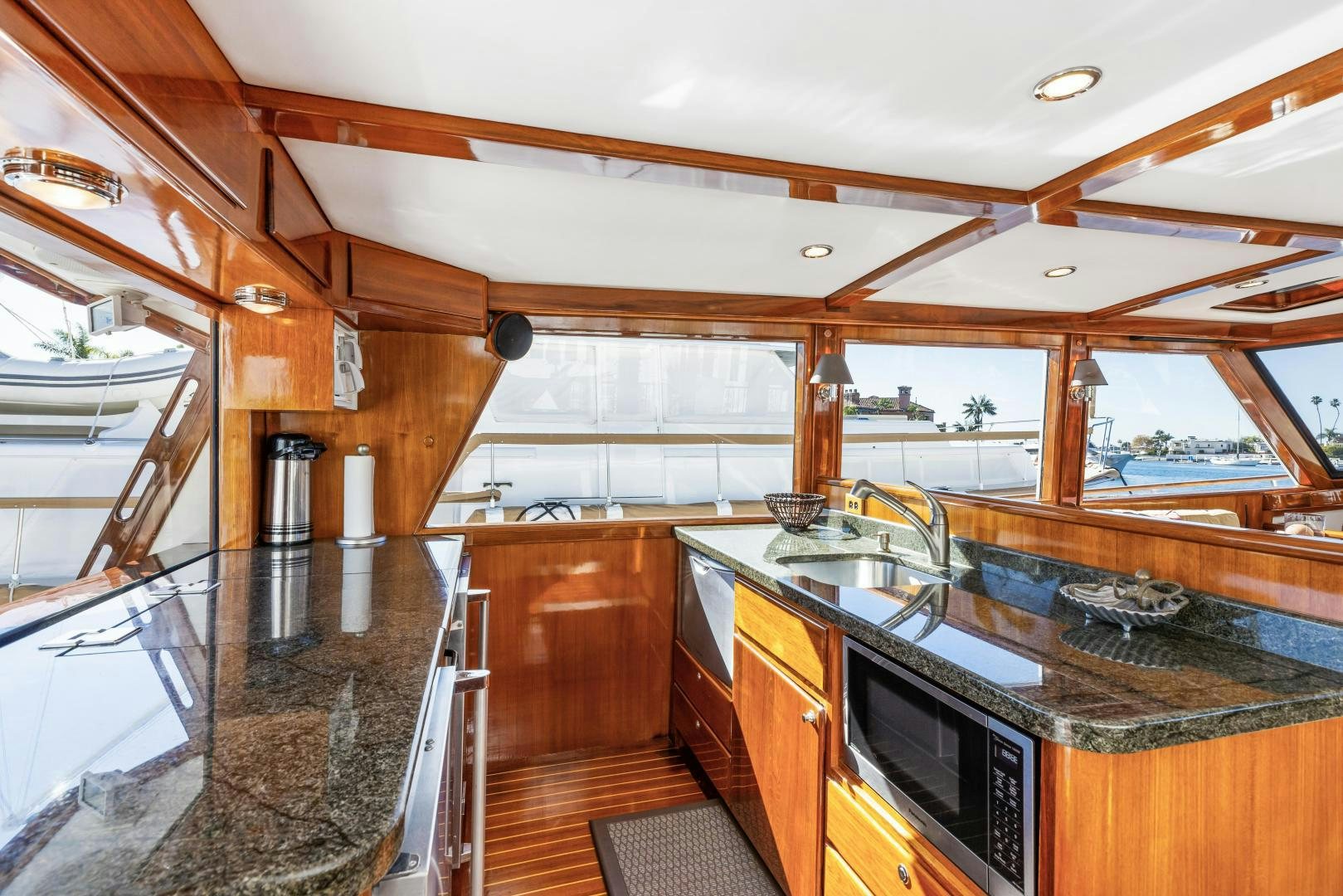 a kitchen with wooden cabinets aboard SILVER OAK Yacht for Sale