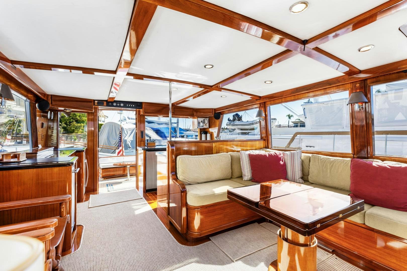 a living room with a table and couches aboard SILVER OAK Yacht for Sale