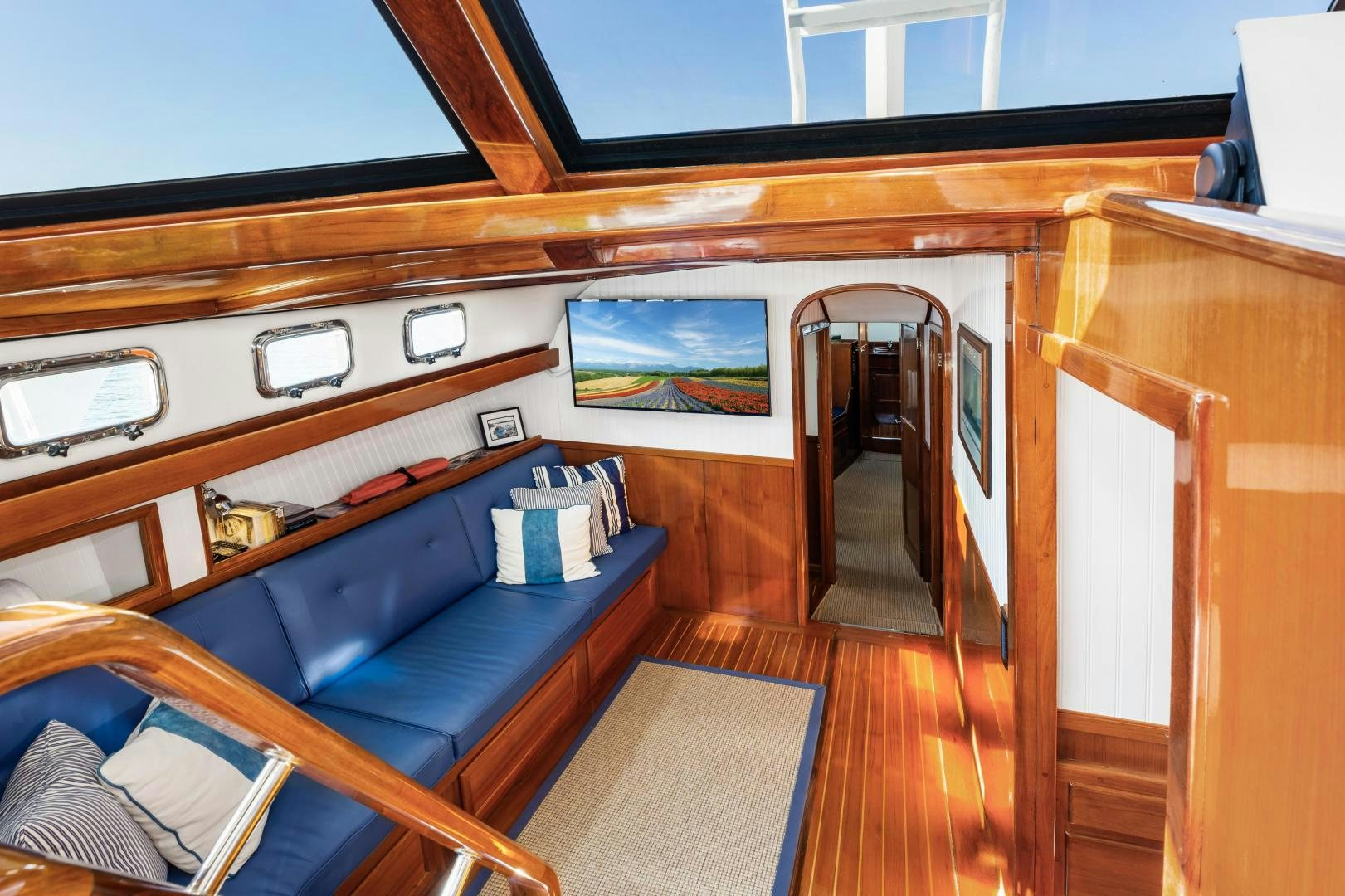 a room with a bed and a desk aboard SILVER OAK Yacht for Sale