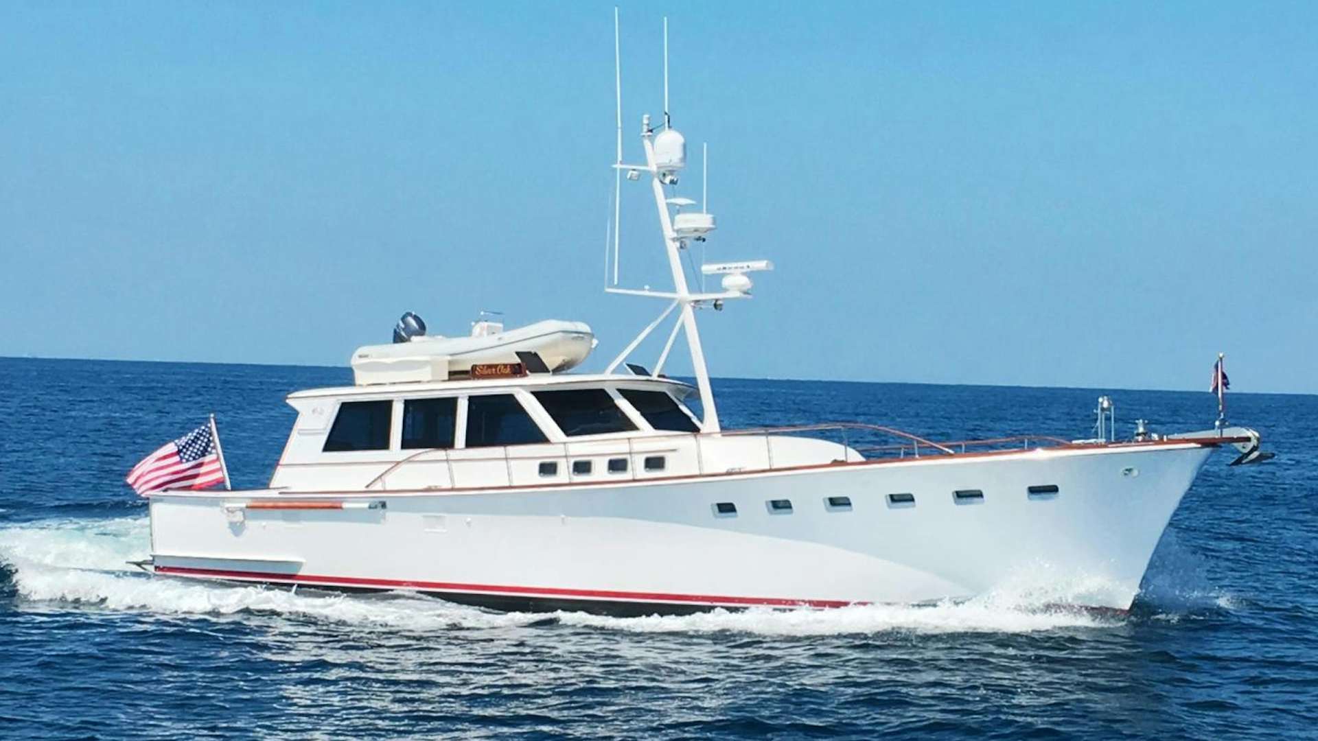 a large white boat in the water aboard SILVER OAK Yacht for Sale