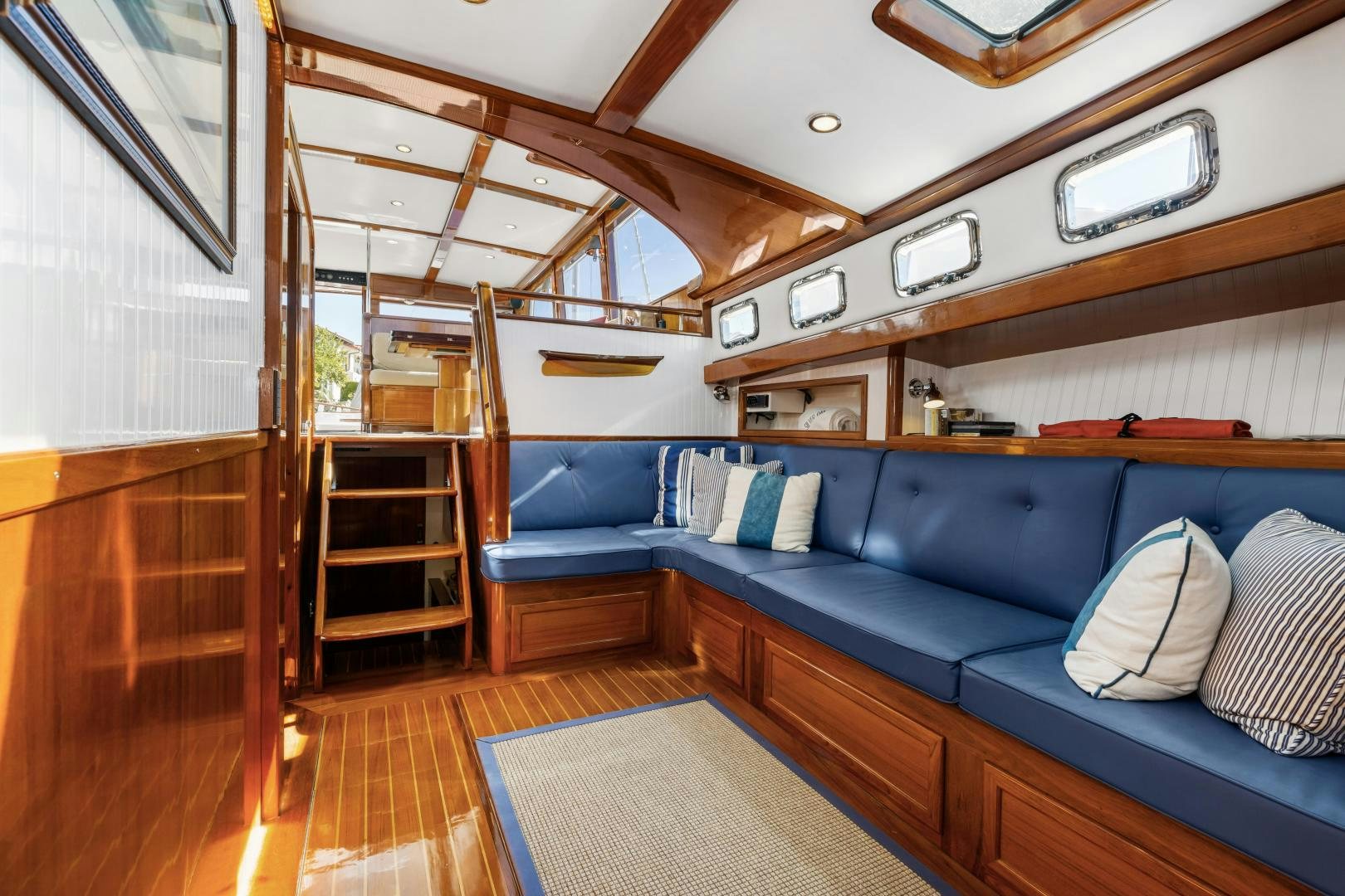 a room with a bed and a couch aboard SILVER OAK Yacht for Sale